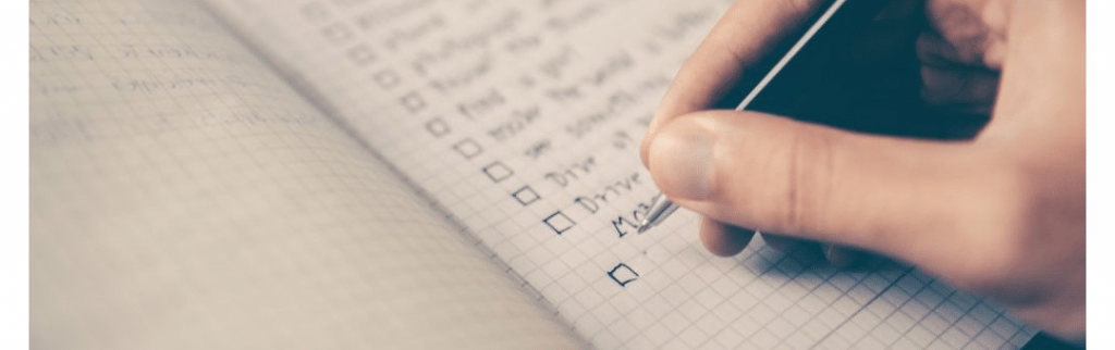 a person checking a box from a moving checklist