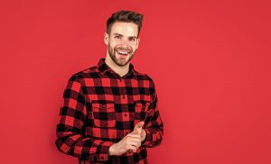 man smiling red shirt