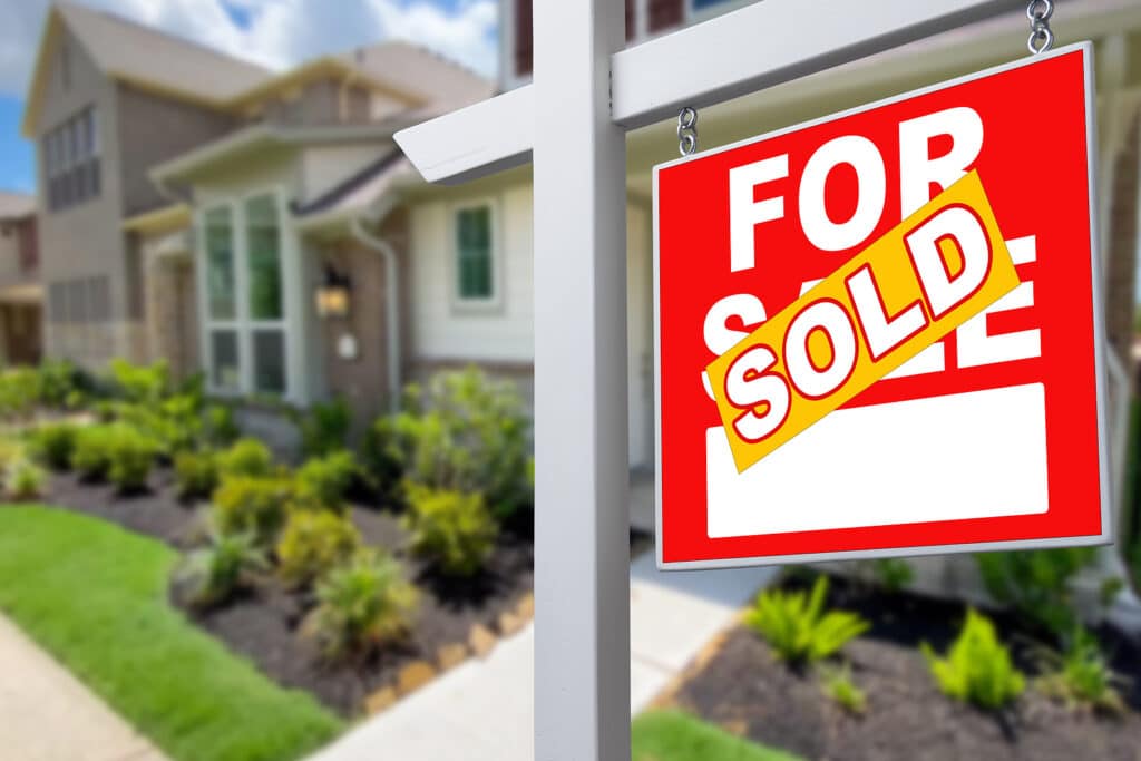 Sold Home For Sale Sign in Front of New House