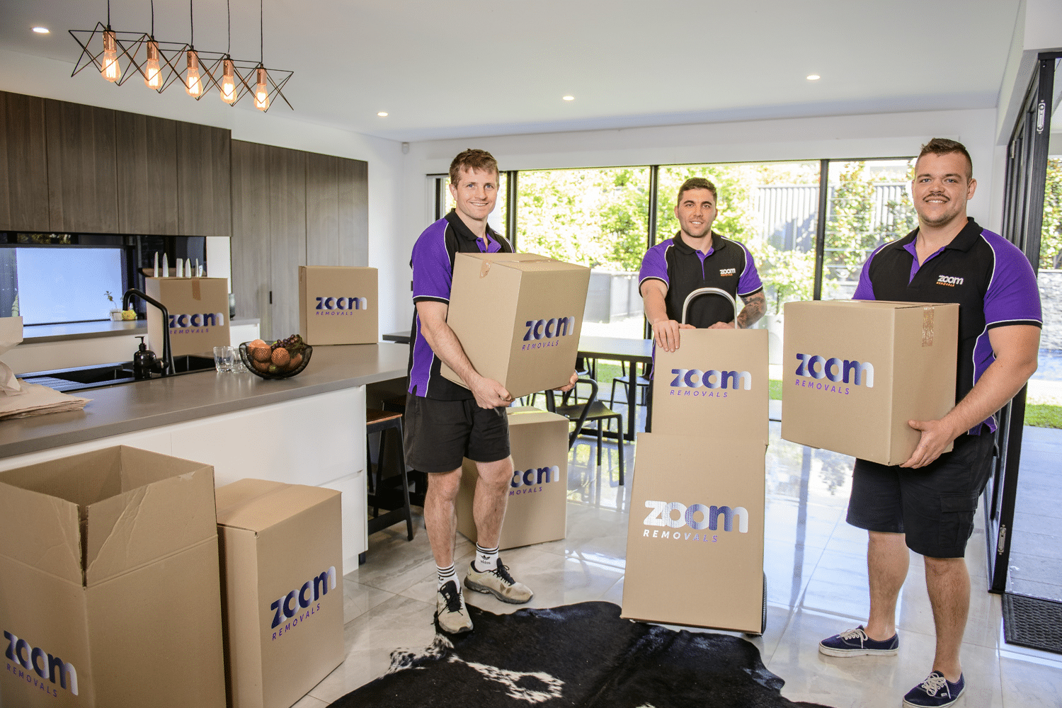 ZOOM Removals Team Holding Boxes